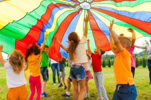 time to play - children under parachute