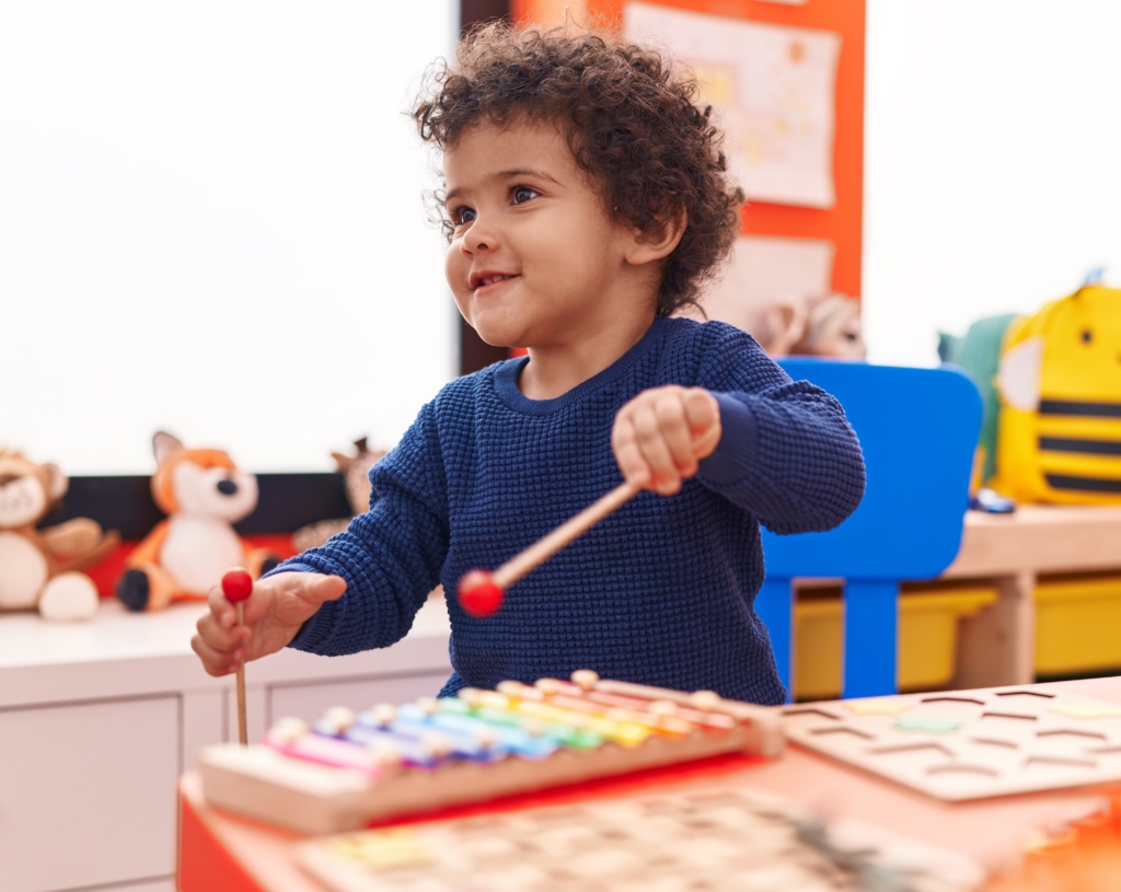 Preschooler playing music