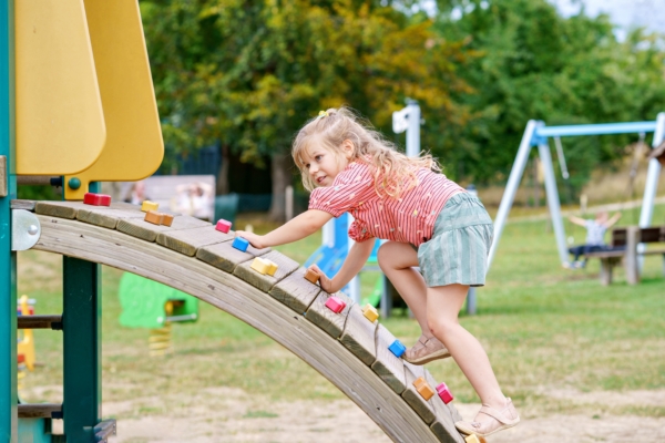 Girl Climbing on Playground
