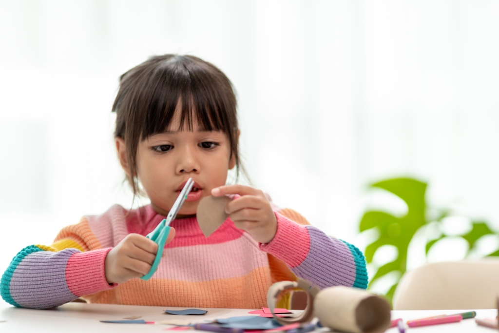 Girl using scissors
